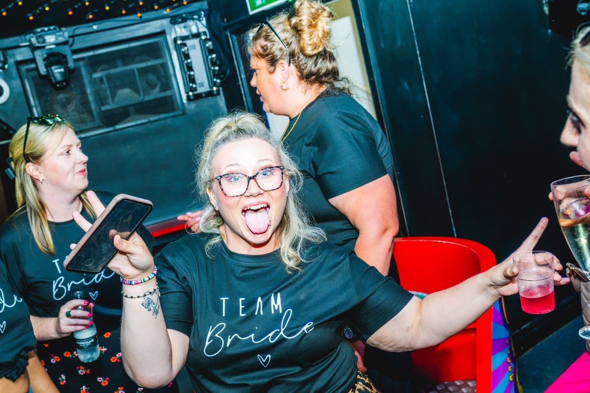 A hen party cheering with the bride at a Brighton bottomless brunch